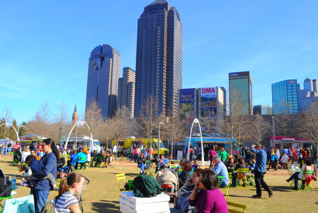 Image shows a festival of sorts happening in Kylde Warren Park in Dallas.