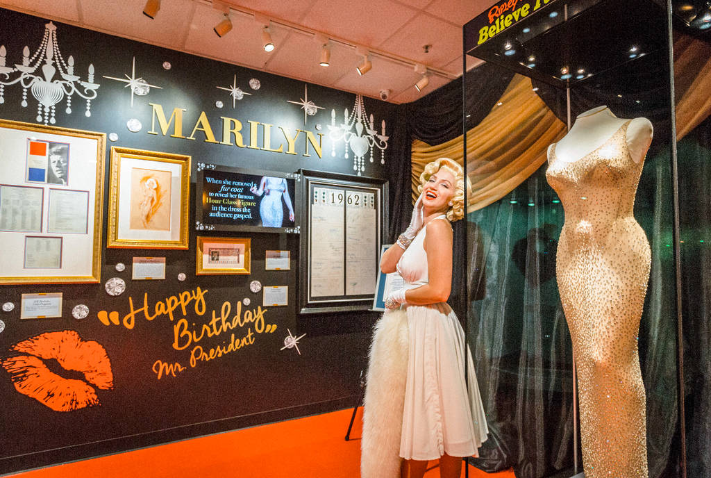 Image shows the Ripley's Believe it or Not Marilyn Monroe exhibition featuring her iconic dress, a wax figure, and more details in the background.