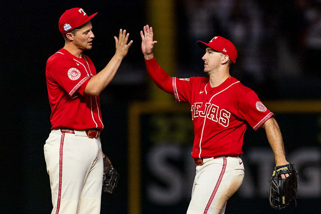 ARLINGTON, TEXAS - JUNE 05: Corey Seager #5 and Wyatt Langford #36 of the Texas Rangers celebrate after a game against the Cleveland Guardians at Globe Life Field on June 05, 2026 in Arlington, Texas. (Photo by John E. Moore III/Getty Images)