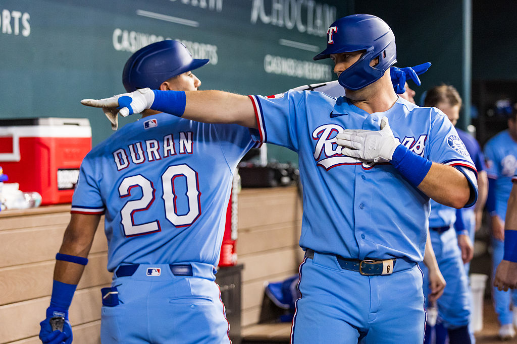 ARLINGTON, TEXAS - JUNE 07: Josh Jung #6 of the Texas Rangers celebrates with Ezequiel Duran #20 after Jung hit a home run during the third inning of a game against the Cleveland Guardians at Globe Life Field on June 07, 2026 in Arlington, Texas. (Photo by John E. Moore III/Getty Images)