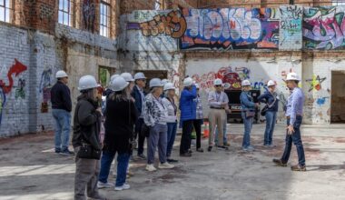 A group of visitors survey the auditorium. These tours provide the nonprofit opportunities to educate the community about the building’s history. Photo courtesy of Ken Sparks/Transform 1012