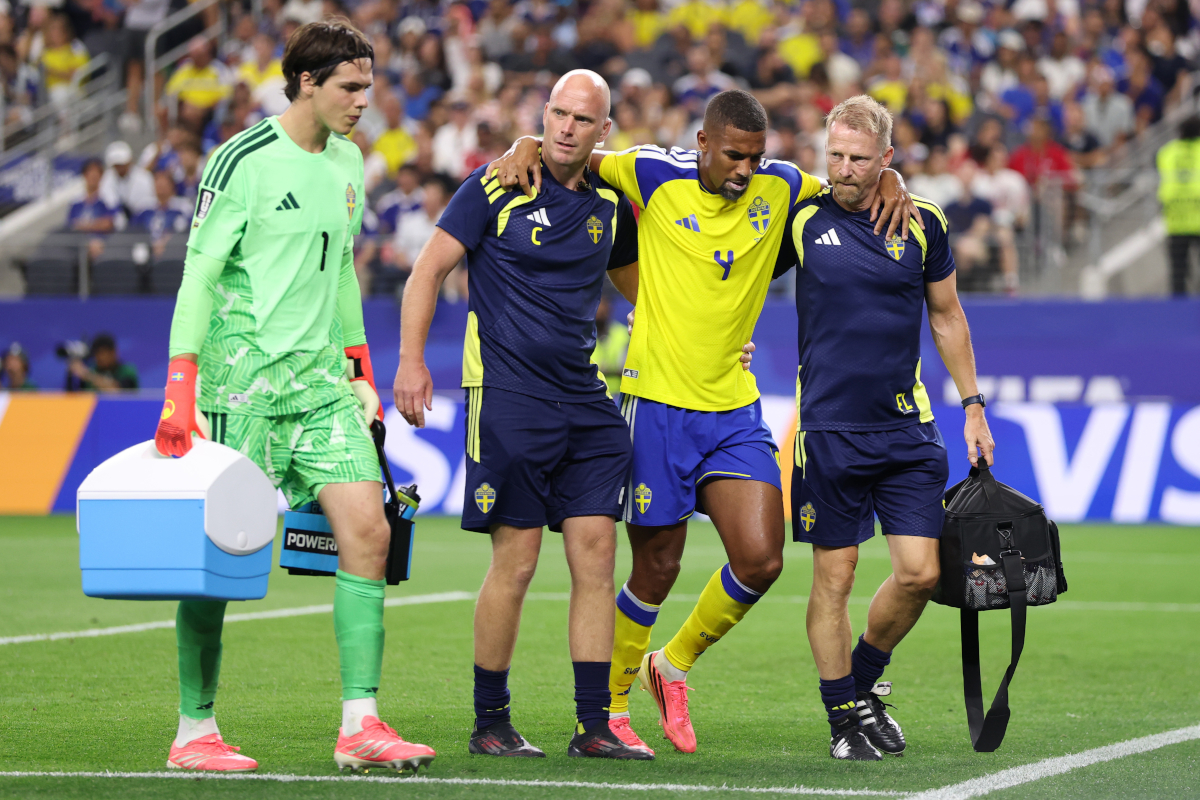 ARLINGTON, TEXAS - JUNE 25: Isak Hien #4 of Sweden is helped by the medical staffs to leave the pitch after sustaining an injury during the FIFA World Cup 2026 Group F match between Japan and Sweden at Dallas Stadium on June 25, 2026 in Arlington, Texas. (Photo by Molly Darlington/Getty Images)