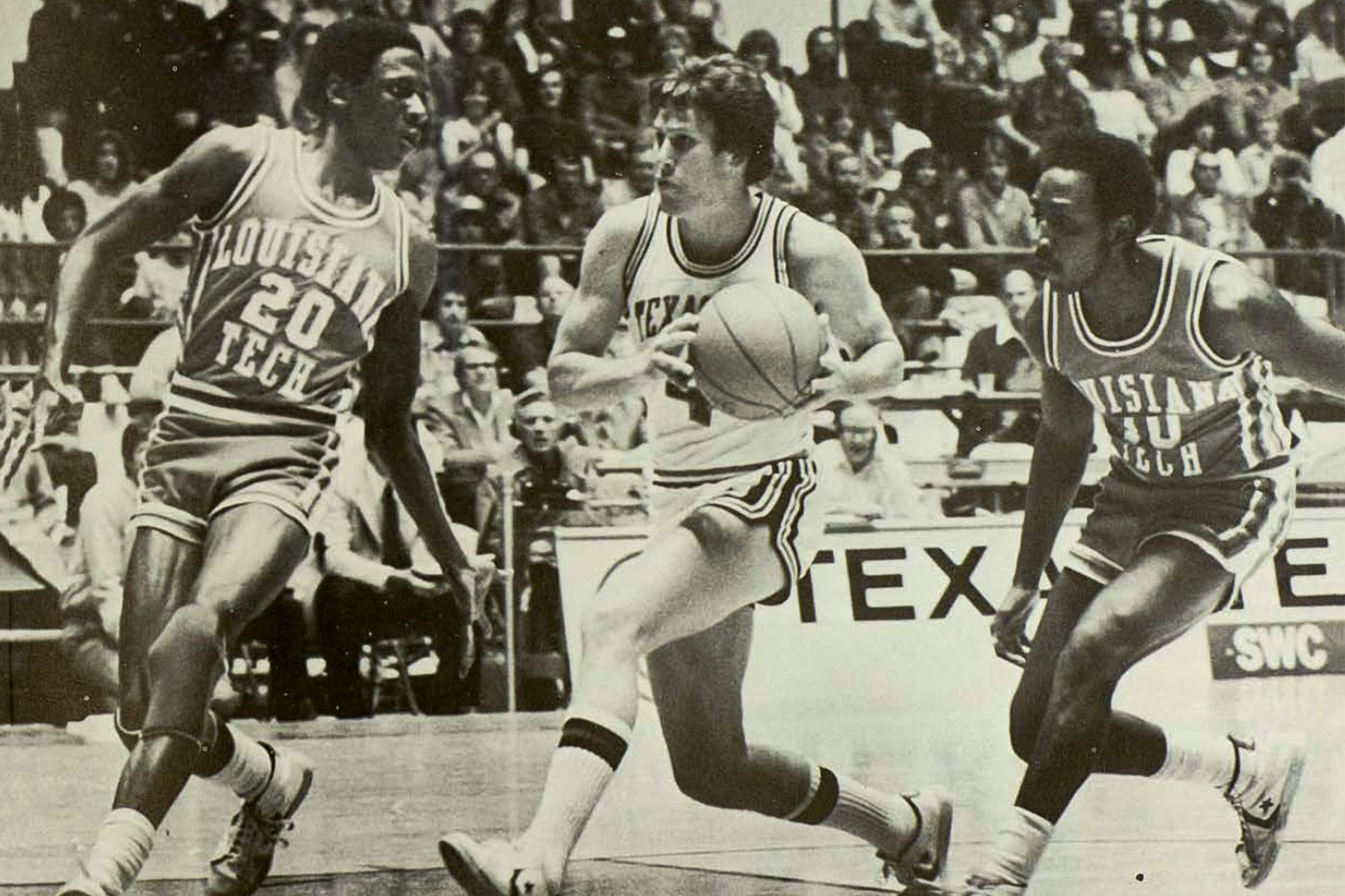 Bubba Jennings moves between two defenders.