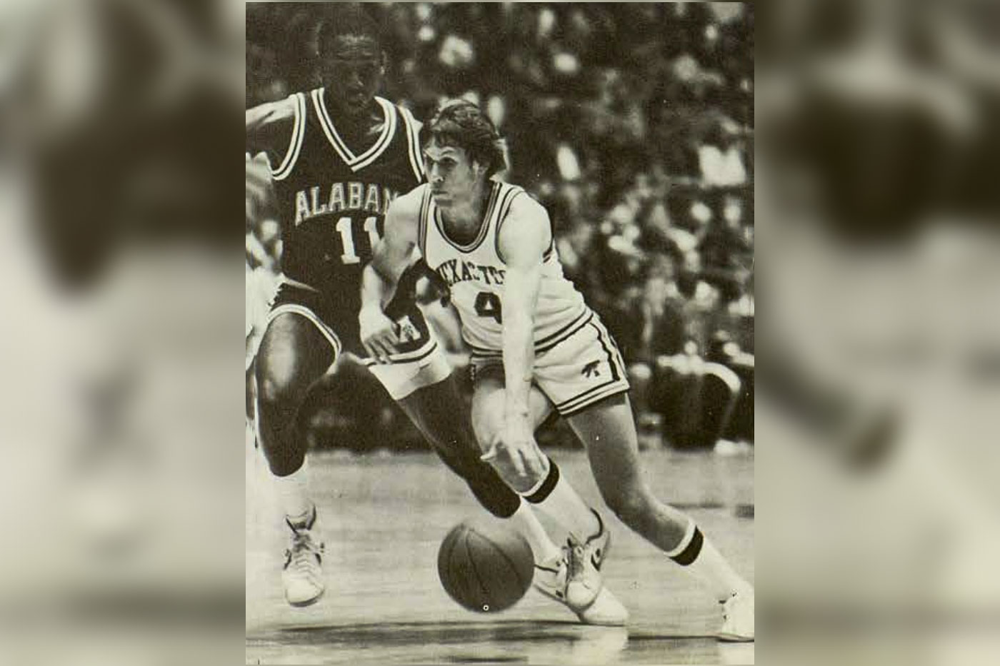 Bubba Jennings dribbles toward the basket.