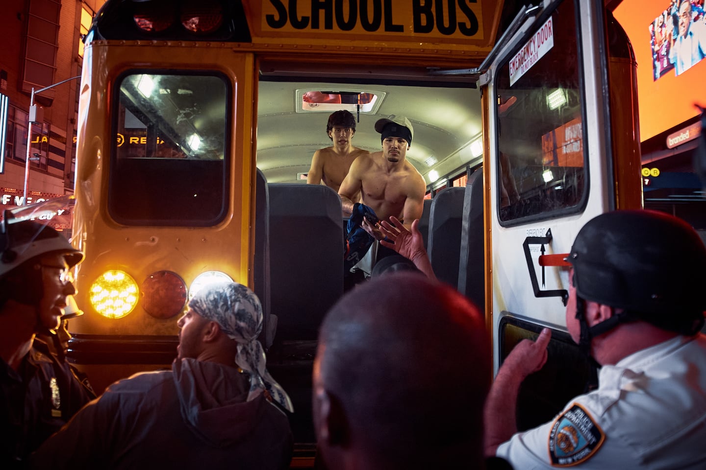 Police remove fans from a school bus as New York Knicks fans celebrate after the Knicks defeated the San Antonio Spurs to win the NBA Finals, early Sunday, June 14, 2026, in New York.