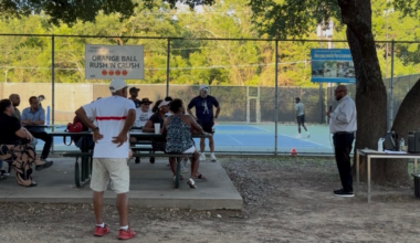 District 4 council member Maxie Johnson addresses community members at a meeting near the tennis courts.