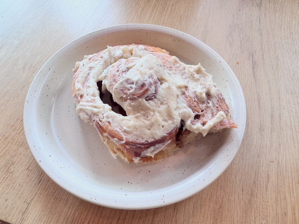 a cinnamon roll on a plate