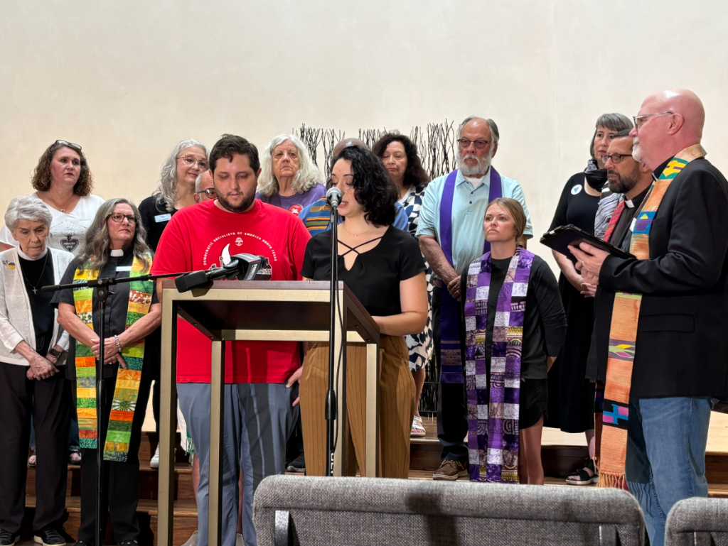 Lanie Olmo and John Putnam speak out against ICE at the press conference.