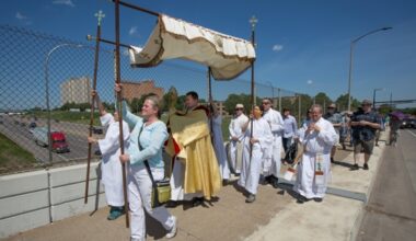 Father R.J. Fichtinger of St. Thomas More Parish in St. Paul, Minn., carries a monstrance with the Blessed Sacrament over the Interstate 94 bridge in St. Paul June 6, 2021, during a procession that began a mile away at St. Peter Claver Church to celebrate the feast of Corpus Christi.