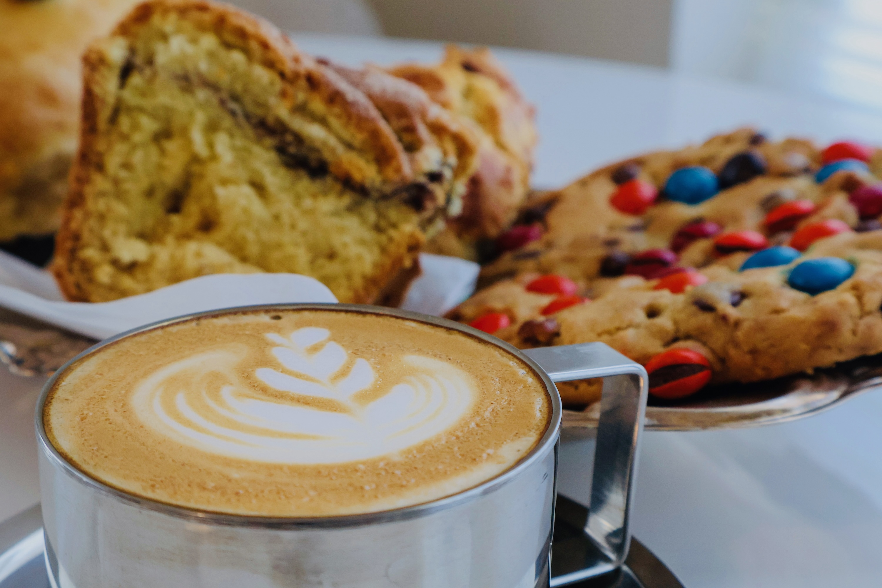 a plate of pastries and a cappuccino at Alma Cafe.