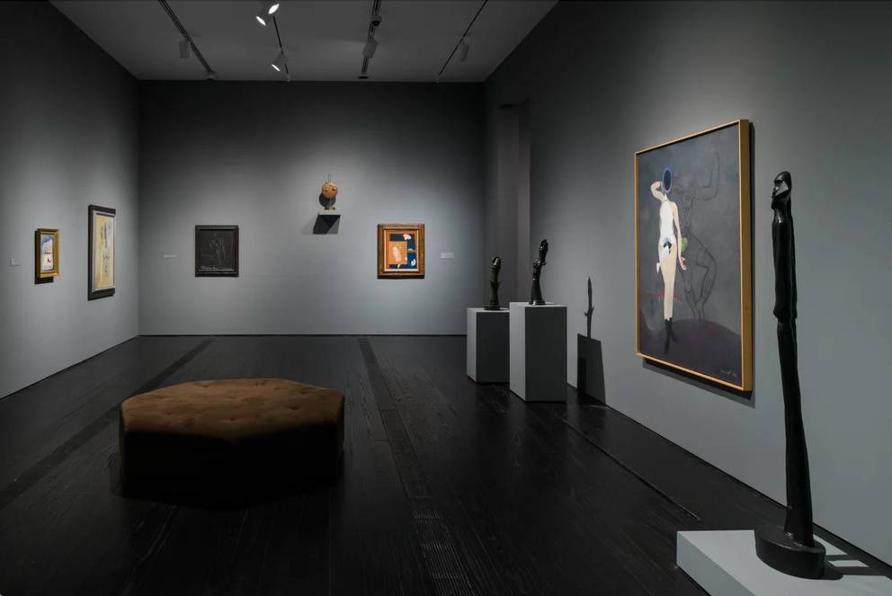 Image shows a Surrealist gallery at the Menil Collection. 