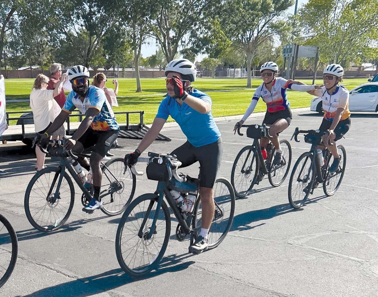 A team of nearly 20 cyclists makes its way through Mesquite en route to Alaska, May 17.