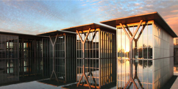 A view of the exterior of the Modern Art Museum of Fort Worth and its reflecting pool.