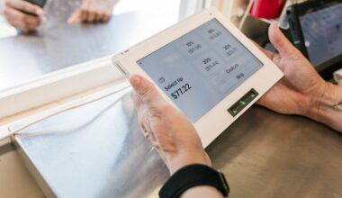 A close-up view of a transaction at the "Hogs and Hops" BBQ event, showcasing the modern payment process. The payment screen displays tipping options while a customer interacts with the staff. The image emphasizes the blend of technology and customer service, reflecting the seamless and efficient transaction experience at the event.