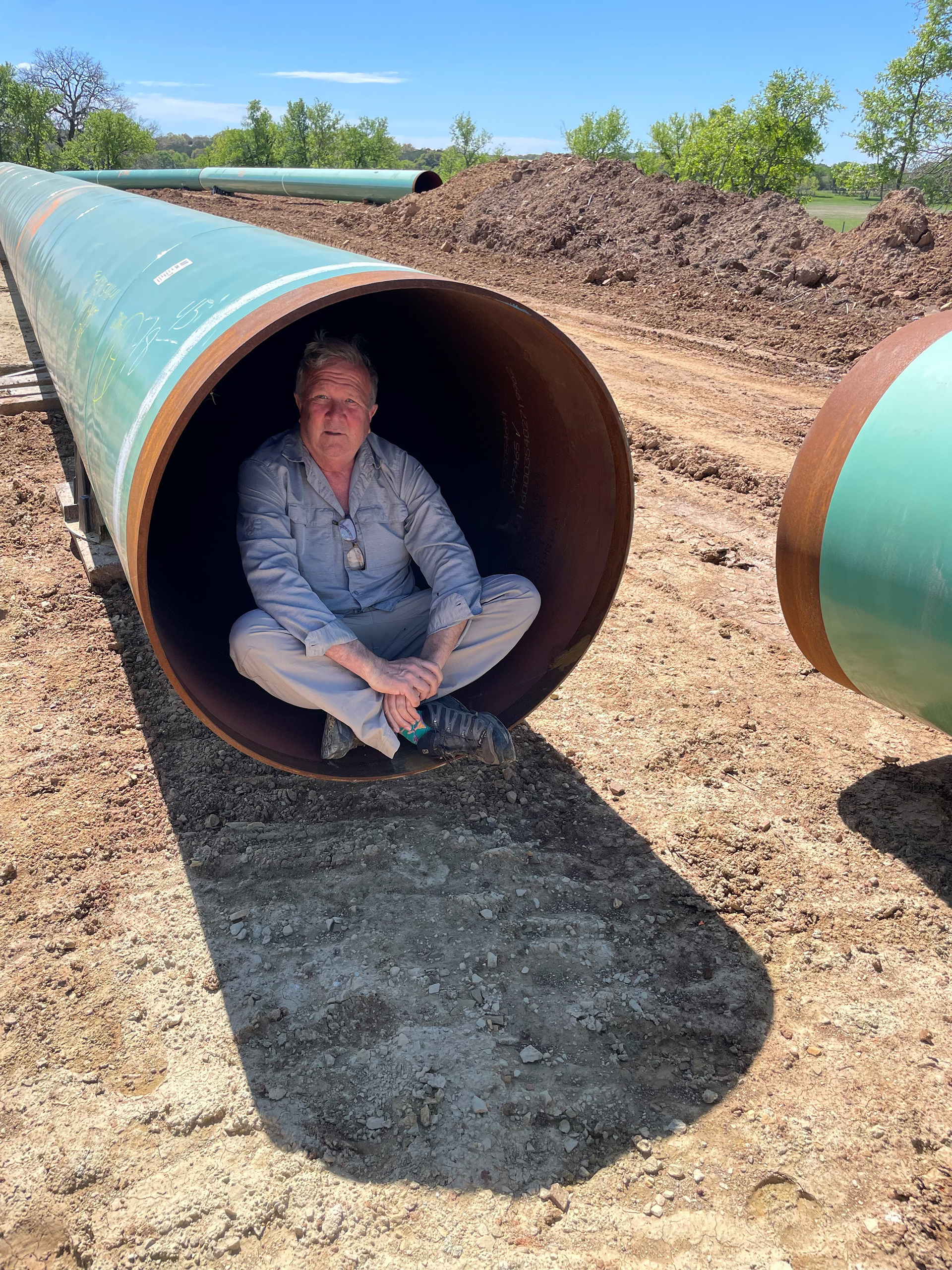 Ty Eggemeyer sits in a pipeline to offer a sense of its size.