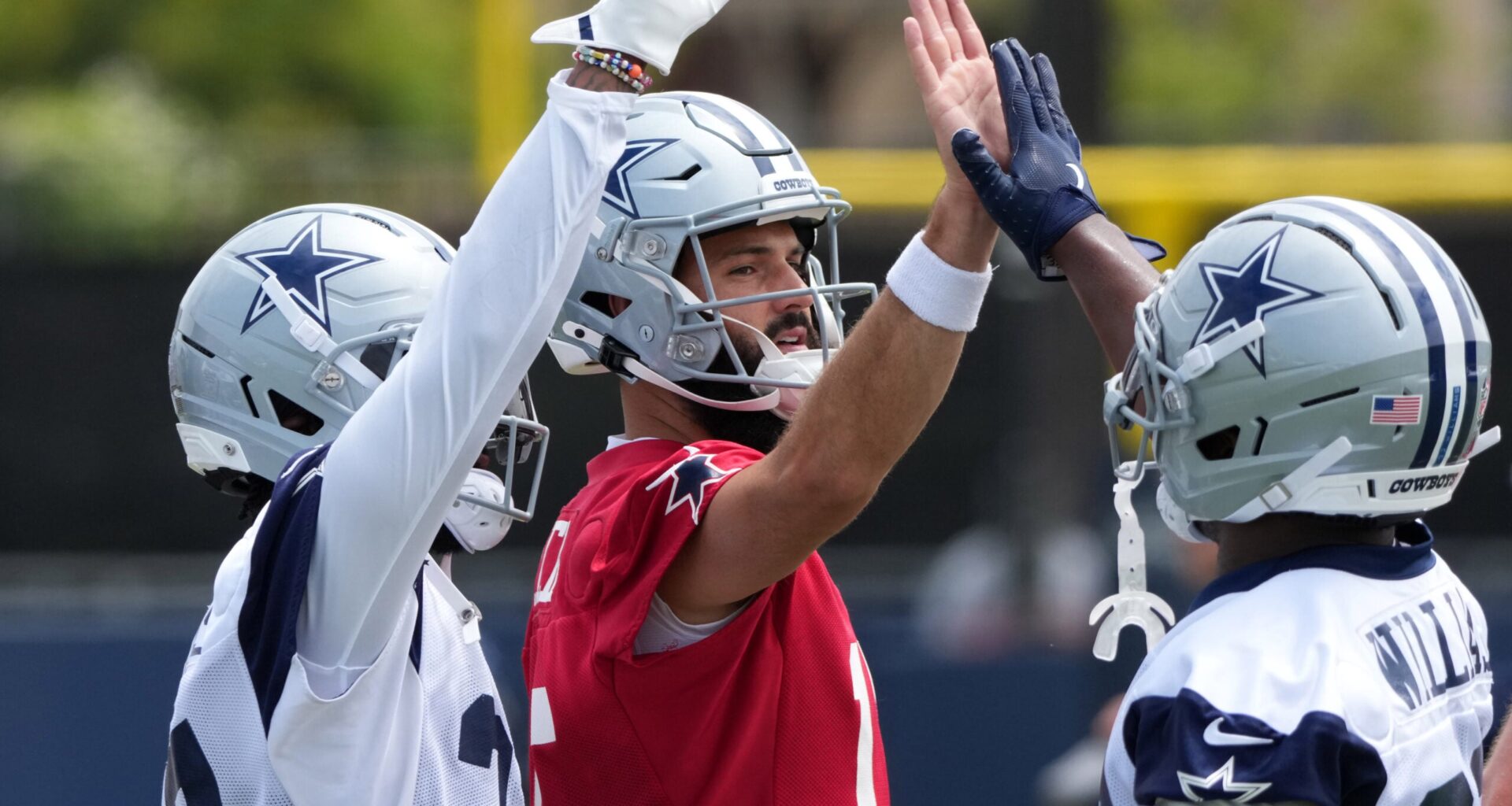 Jul 22, 2025; Oxnard, CA, USA; Dallas Cowboys quarterback Will Grier (15) with running back Javonte Williams (33) during training camp at the River Ridge Fields.