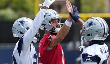 Jul 22, 2025; Oxnard, CA, USA; Dallas Cowboys quarterback Will Grier (15) with running back Javonte Williams (33) during training camp at the River Ridge Fields.