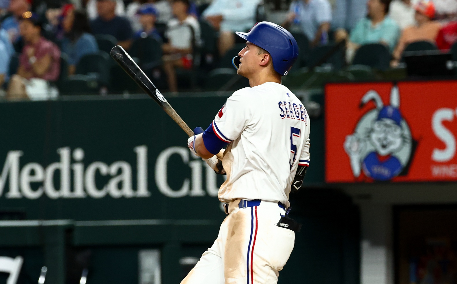 Jul 22, 2025; Arlington, Texas, USA; Texas Rangers shortstop Corey Seager (5) hits a three-run home run during the seventh inning against the Athletics at Globe Life Field. Mandatory Credit: Kevin Jairaj-Imagn Images
