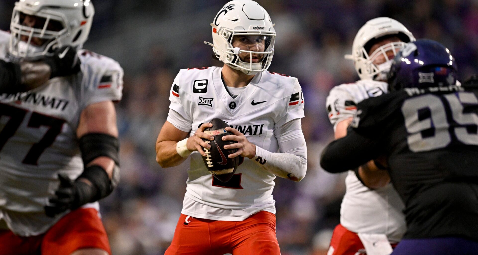 Nov 29, 2025; Fort Worth, Texas, USA; Cincinnati Bearcats quarterback Brendan Sorsby (2) drops back to pass against the TCU Horned Frogs during the first half at Amon G. Carter Stadium.