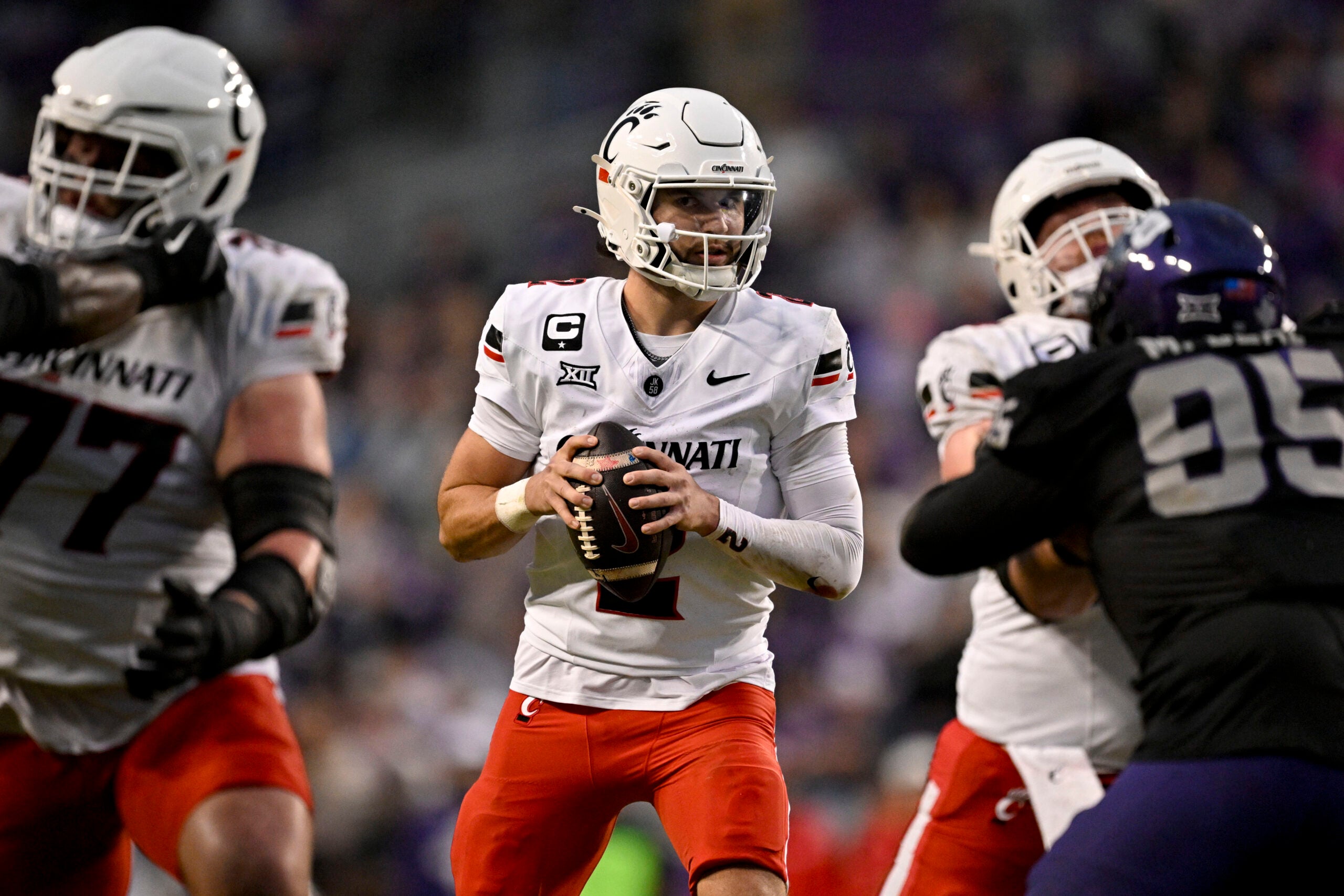 Nov 29, 2025; Fort Worth, Texas, USA; Cincinnati Bearcats quarterback Brendan Sorsby (2) drops back to pass against the TCU Horned Frogs during the first half at Amon G. Carter Stadium.