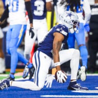 Dec 21, 2025; Arlington, Texas, USA; Dallas Cowboys wide receiver Ryan Flournoy (19) celebrates after catching a touchdown pass against the Los Angeles Chargers during the first quarter at AT&T Stadium.