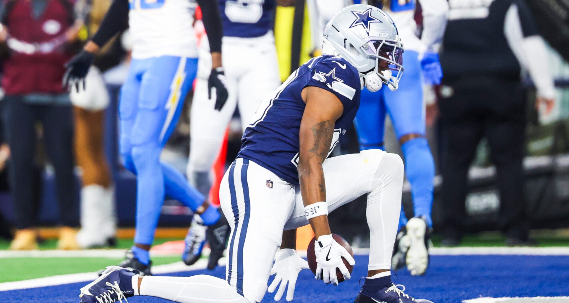 Dec 21, 2025; Arlington, Texas, USA; Dallas Cowboys wide receiver Ryan Flournoy (19) celebrates after catching a touchdown pass against the Los Angeles Chargers during the first quarter at AT&T Stadium.