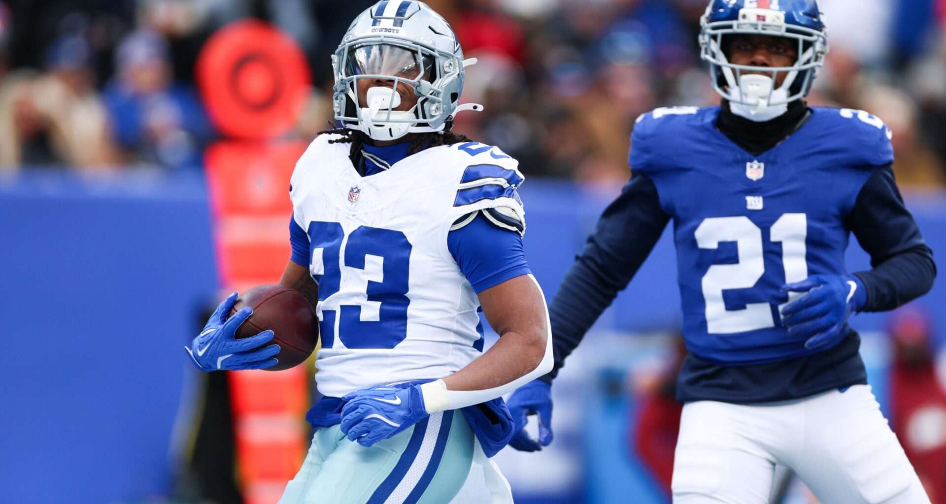 Jan 4, 2026; East Rutherford, New Jersey, USA; Dallas Cowboys running back Jaydon Blue (23) celebrates after scoring a touchdown during the first quarter against the New York Giants at MetLife Stadium.
