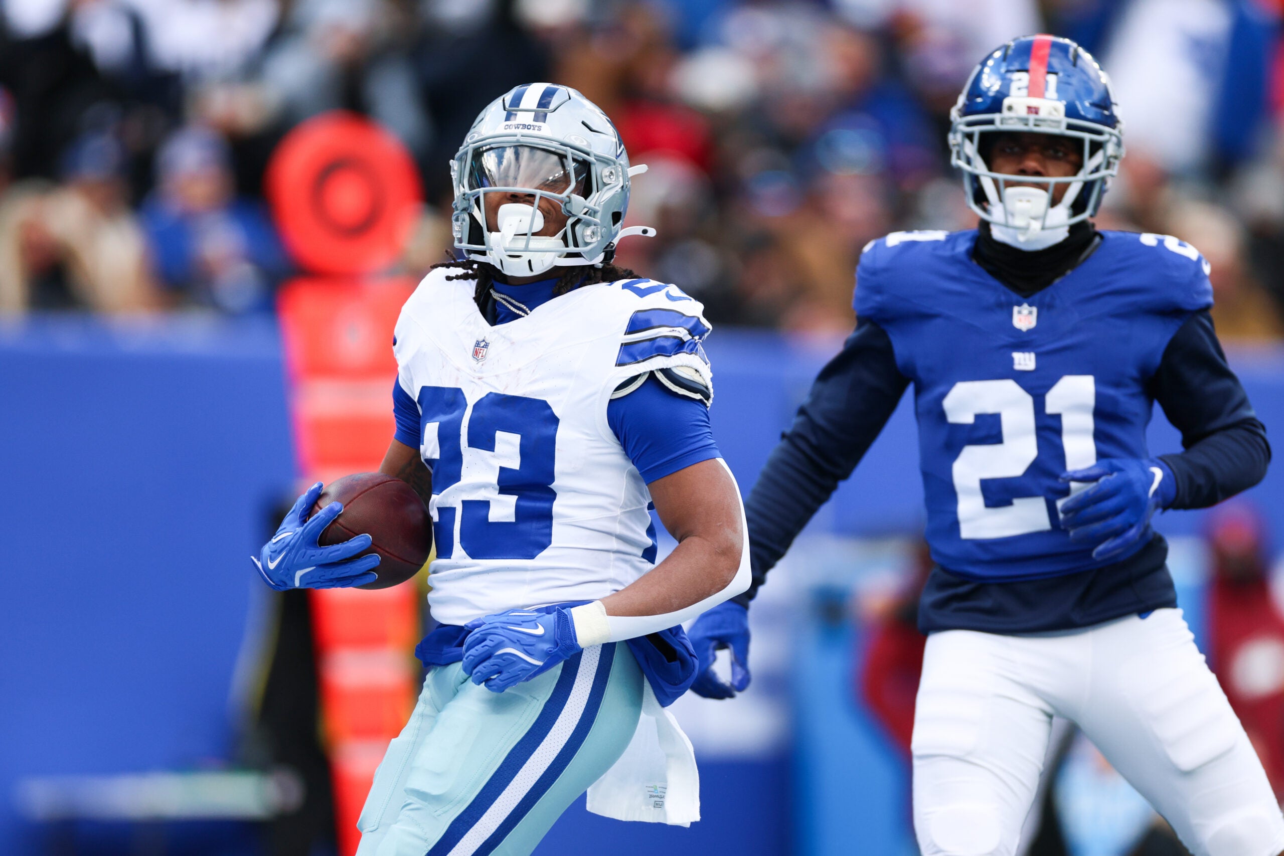Jan 4, 2026; East Rutherford, New Jersey, USA; Dallas Cowboys running back Jaydon Blue (23) celebrates after scoring a touchdown during the first quarter against the New York Giants at MetLife Stadium.