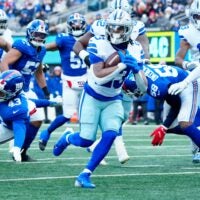 Dallas Cowboys running back Jaydon Blue (23) scores the first touchdown of the game, Sunday, January 4, 2026, in East Rutherford.