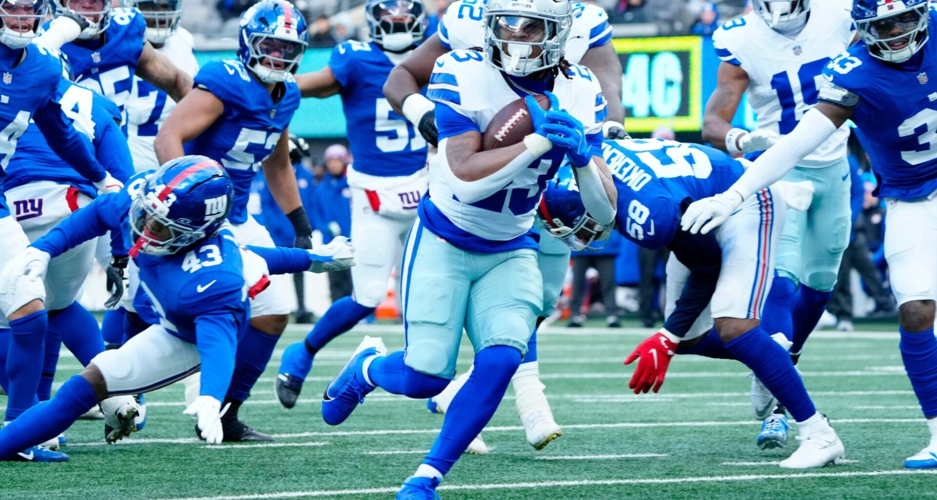 Dallas Cowboys running back Jaydon Blue (23) scores the first touchdown of the game, Sunday, January 4, 2026, in East Rutherford.