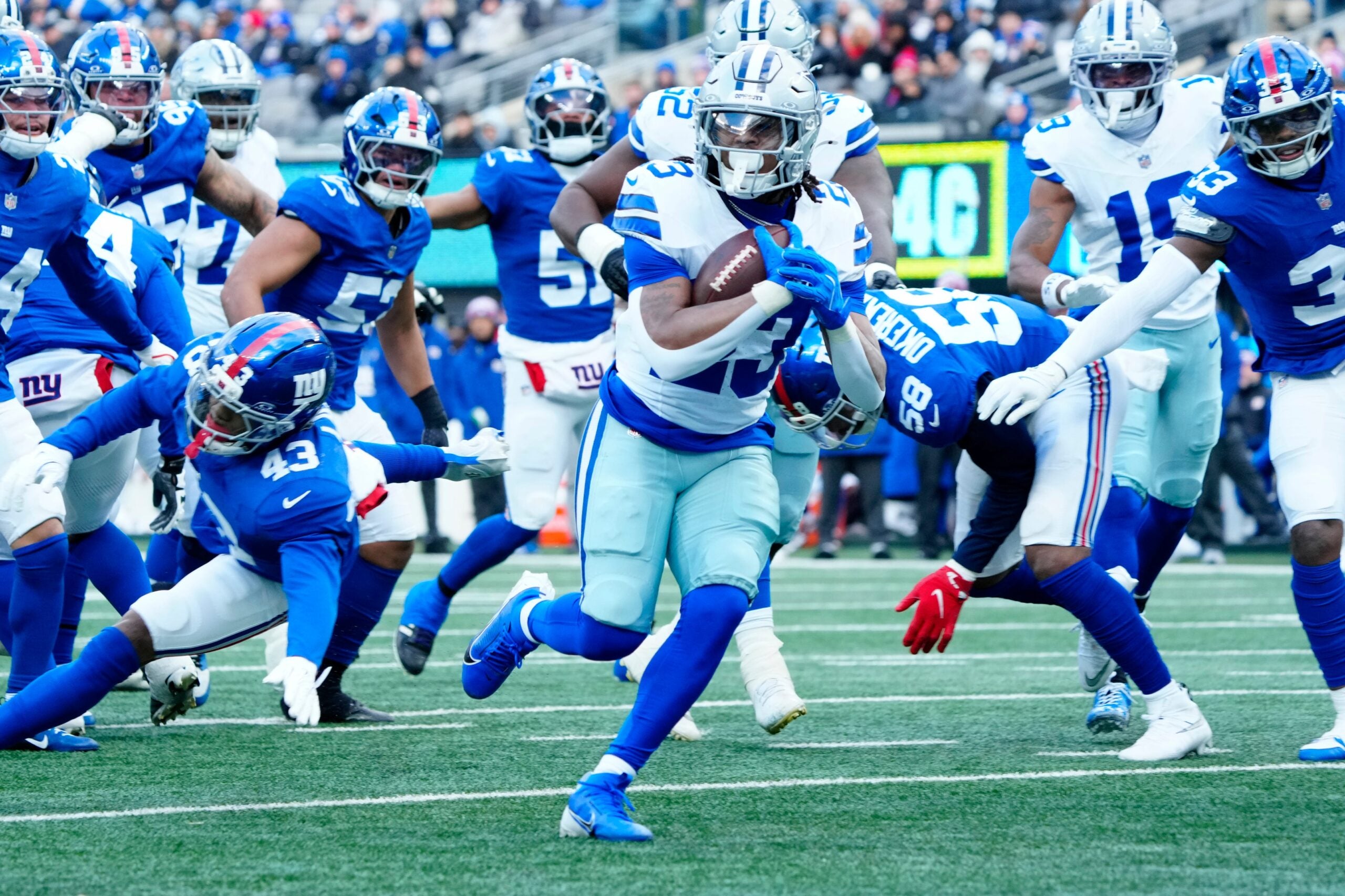 Dallas Cowboys running back Jaydon Blue (23) scores the first touchdown of the game, Sunday, January 4, 2026, in East Rutherford.