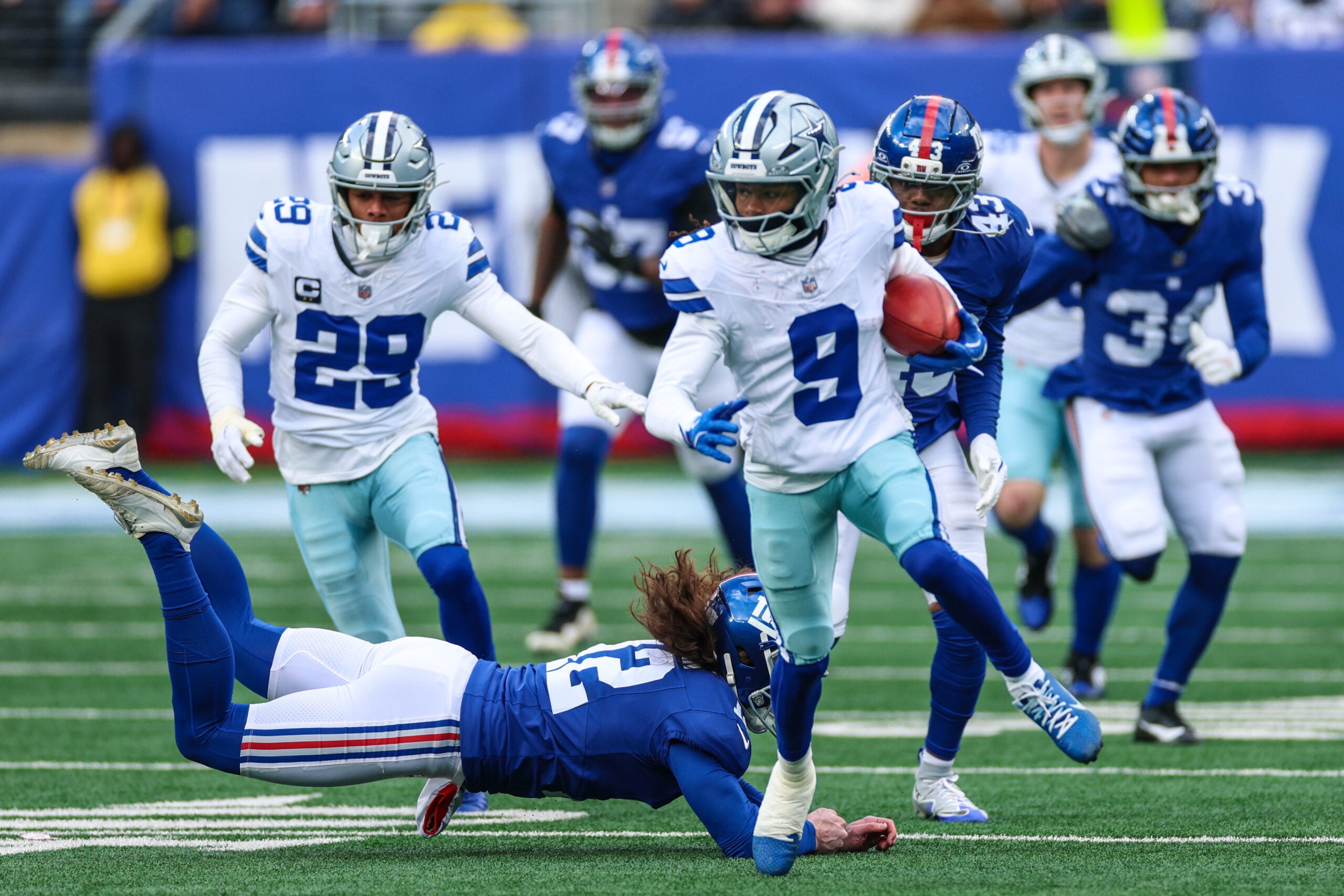 Jan 4, 2026; East Rutherford, New Jersey, USA; Dallas Cowboys wide receiver Kavontae Turpin (9) returns a kickoff as New York Giants punter Jamie Gillan (12) pursues during the second half at MetLife Stadium.