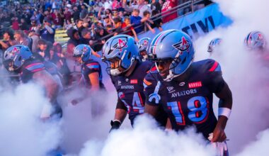 Columbus Aviators guard Chris Glaser (64) and wide receiver Roc Taylor (18) take the field with their teammates before the Columbus Aviators inaugural home game at Historic Crew Stadium on Friday, April 3, 2026 in Columbus, Ohio.