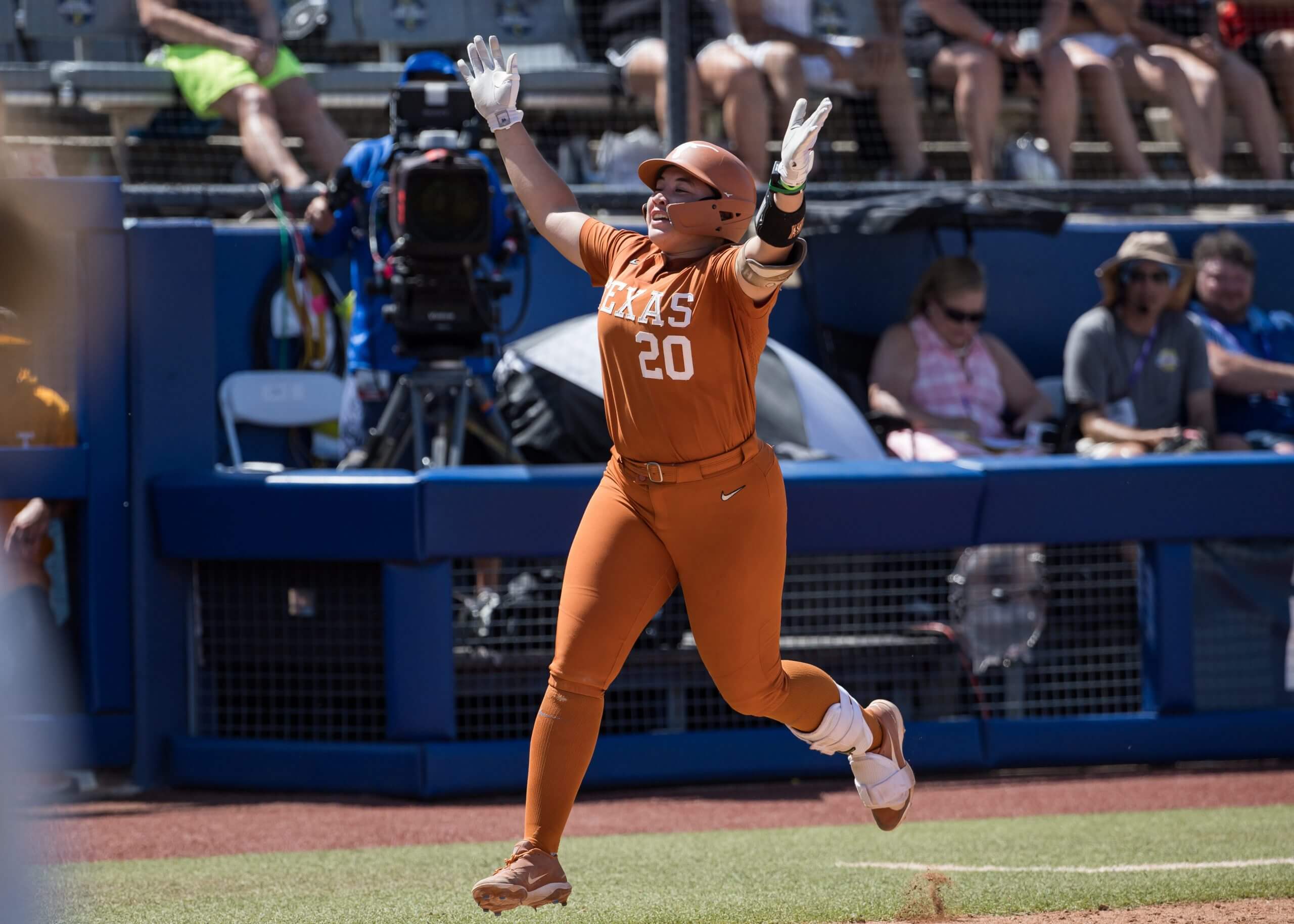 Katie Stewart celebrates a home run as she rounds the bases. 