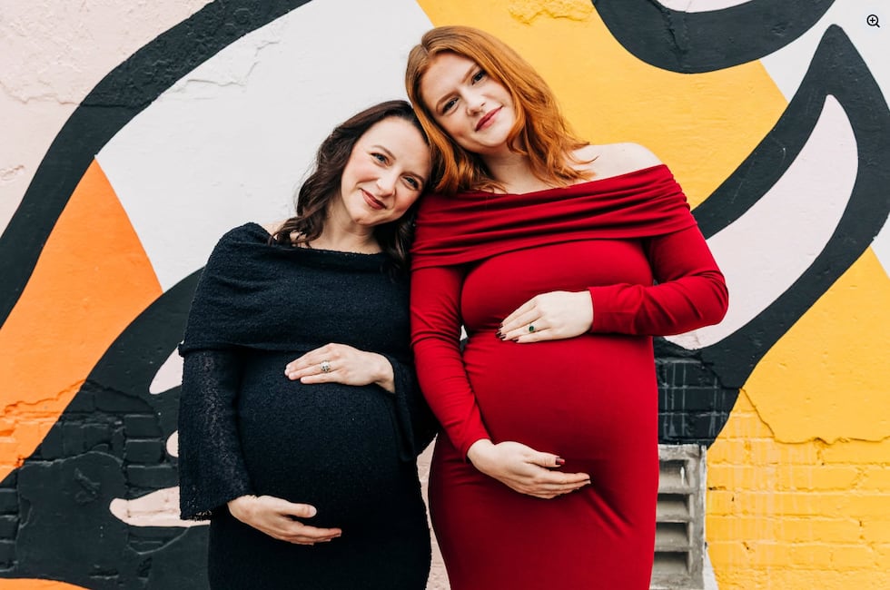 A maternity photo of the two sisters posing together when they were pregnant.