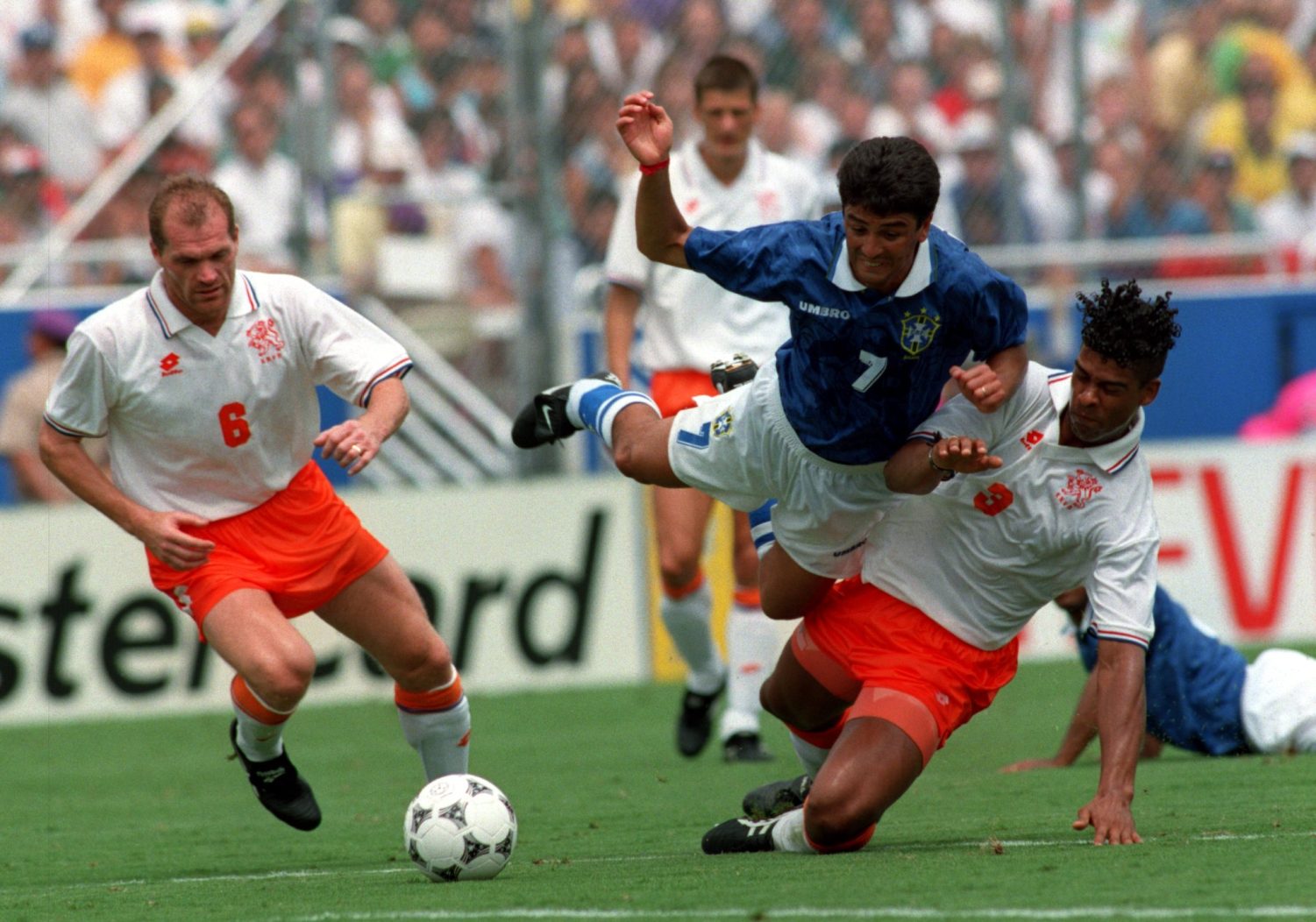 9 Jul 1994: Bebeto of Brazil, in air, and Nouters, right, and Rijkaard of Holland in action during the 1994 World Cup match Brazil v Holland at the Cotton Bowl