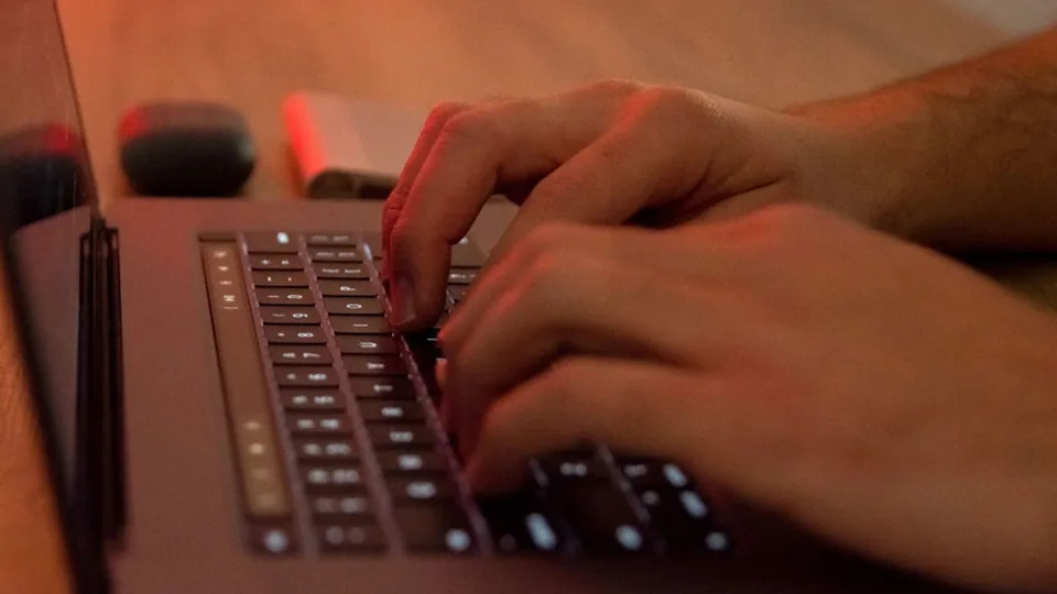 <div>Man's hands are writting on a Macintosh (Apple) laptop in Athens, Greece on April 4, 2022. (Photo by Nikolas Kokovlis/NurPhoto via Getty Images)</div>