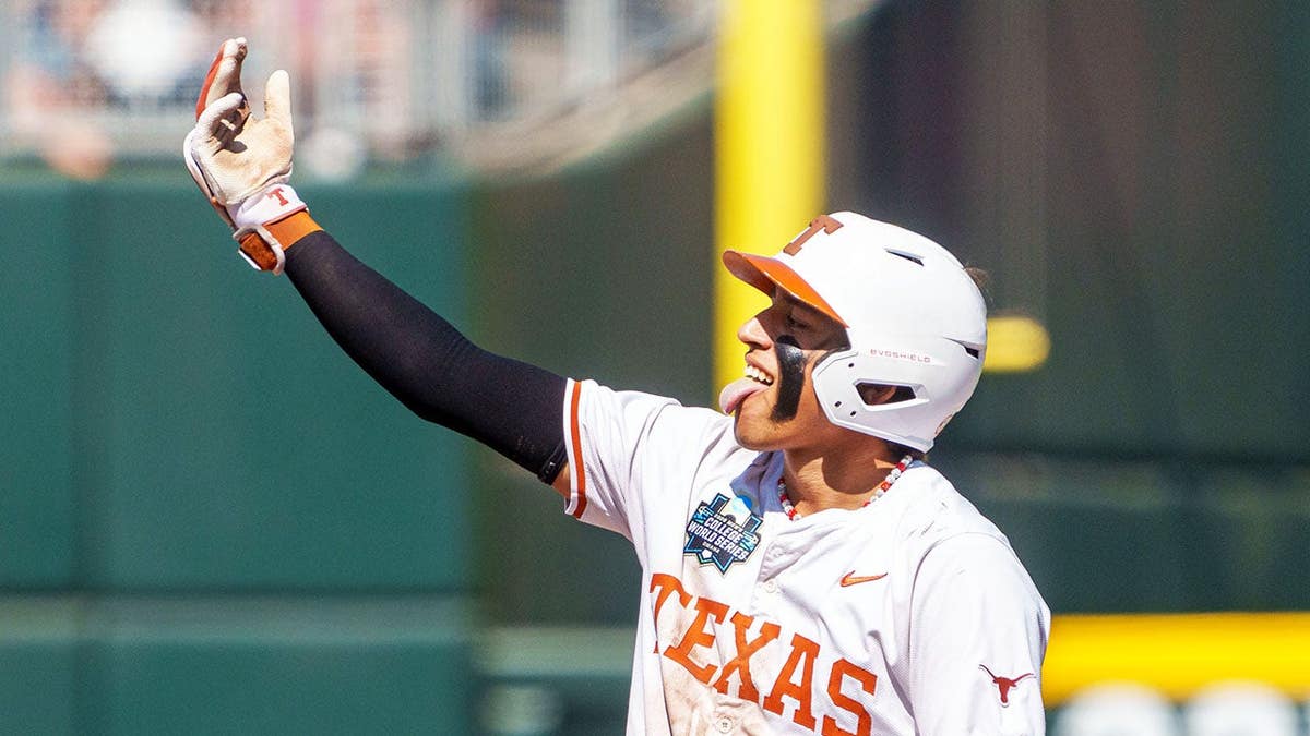 Texas Longhorns shortstop Adrian Rodriguez celebrating after hitting a double at Charles Schwab Field.