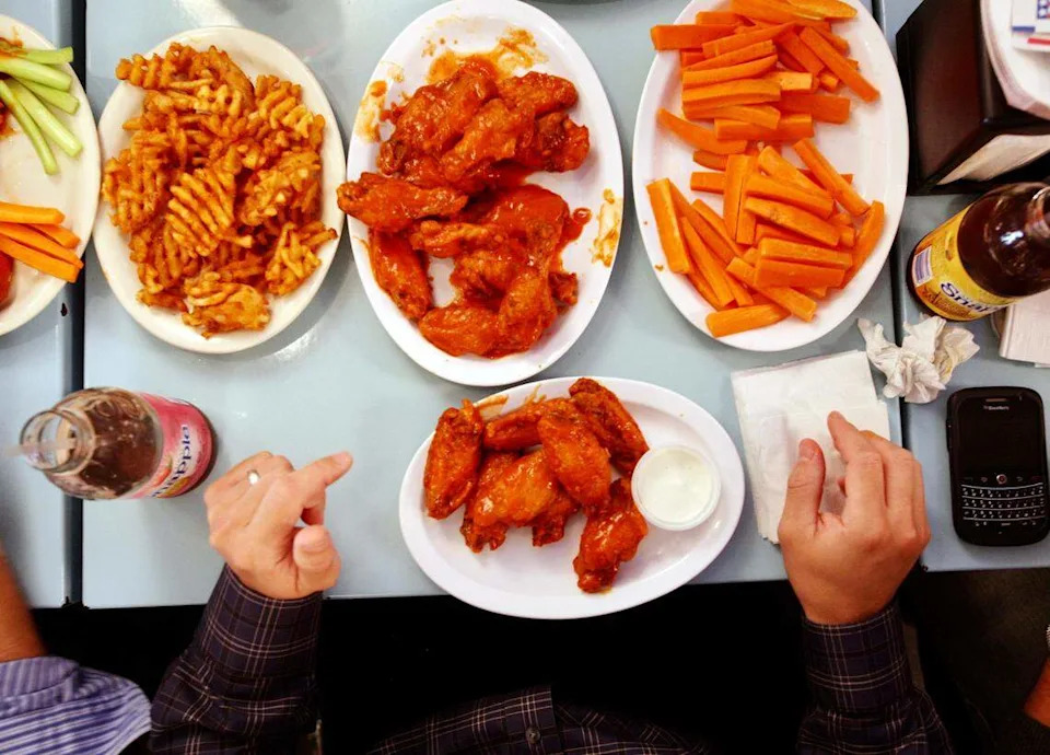 Chicken wings and sides at Atomic Wings in Midtown Manhattan. The restaurant is opening in Arlington.