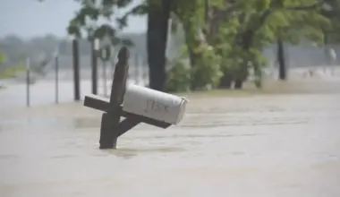A mailbox is partially submerged on a flooded street in an unincorporated area in east Harris County near Houston on Sunday morning, May 5, 2024.