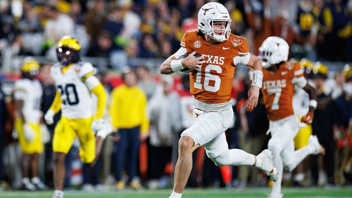 Texas Longhorns quarterback Arch Manning running with the ball at Camping World Stadium