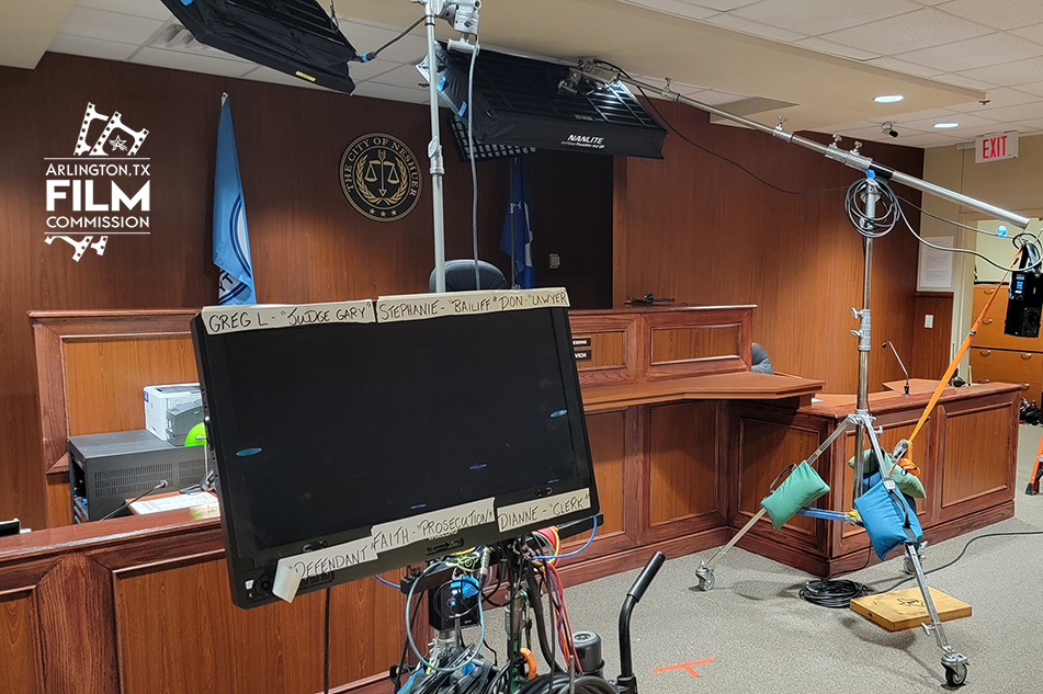 Film equipment set up in a courtroom.