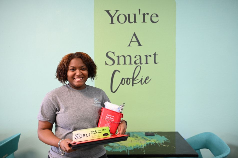 Owner of Tea's Bakery with welcome kit