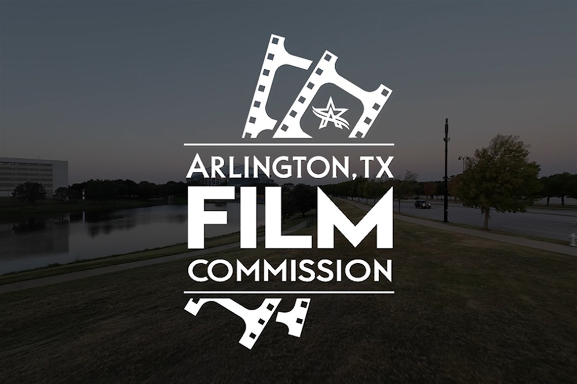 Arlington, TX Film Commission logo in white with faded view of Entertainment District in background.