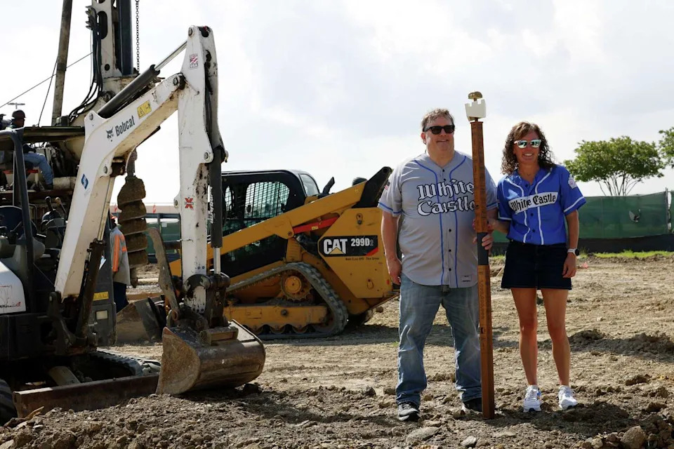 White Castle Chief People Officer John Kelley and Corporate Relations Manager Erin Shannon, whose great-grandfather started the company in 1921, pose for a photo after a groundbreaking ceremony for White Castle in The Colony. (Chitose Suzuki/The Dallas Morning News)