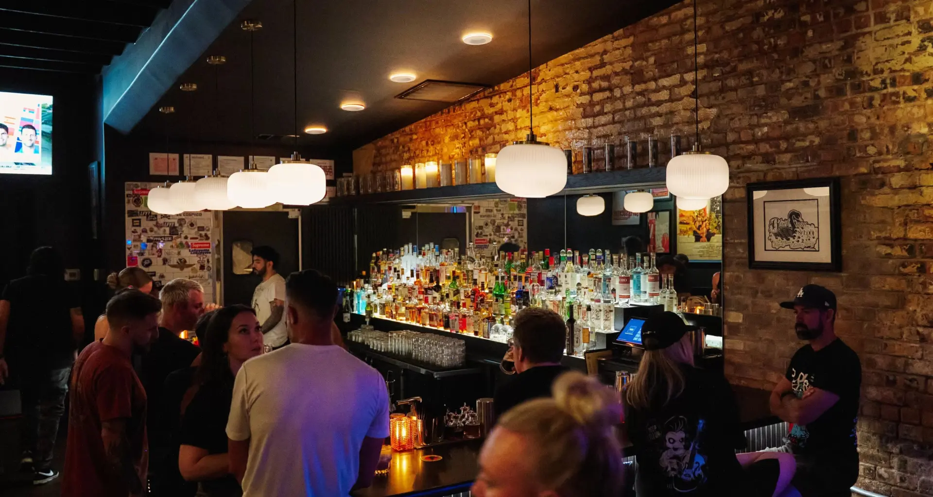 a crowd at The Black Swan Saloon