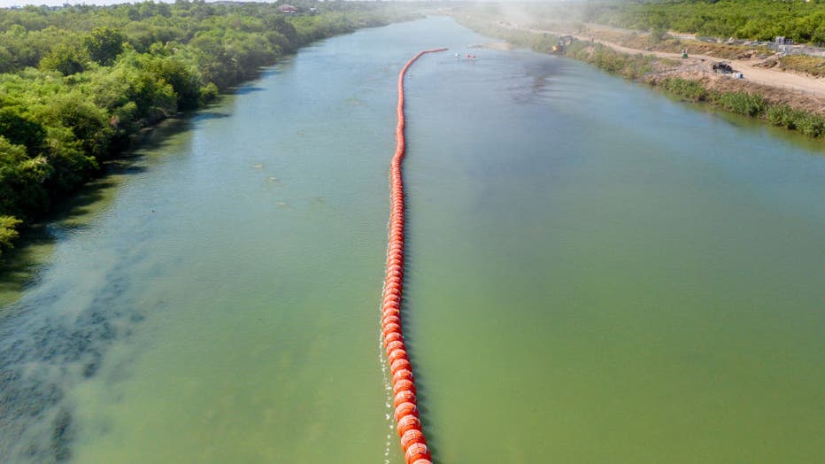  Buoy barriers are installed and situated in the middle of the Rio Grande river on July 18, 2023, in Eagle Pass, Texas.
