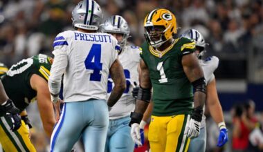 Sep 28, 2025; Arlington, Texas, USA; Green Bay Packers defensive end Micah Parsons (1) stares at Dallas Cowboys quarterback Dak Prescott (4) during the game between the Dallas Cowboys and the Green Bay Packers at AT&T Stadium. Mandatory Credit: Jerome Miron-Imagn Images