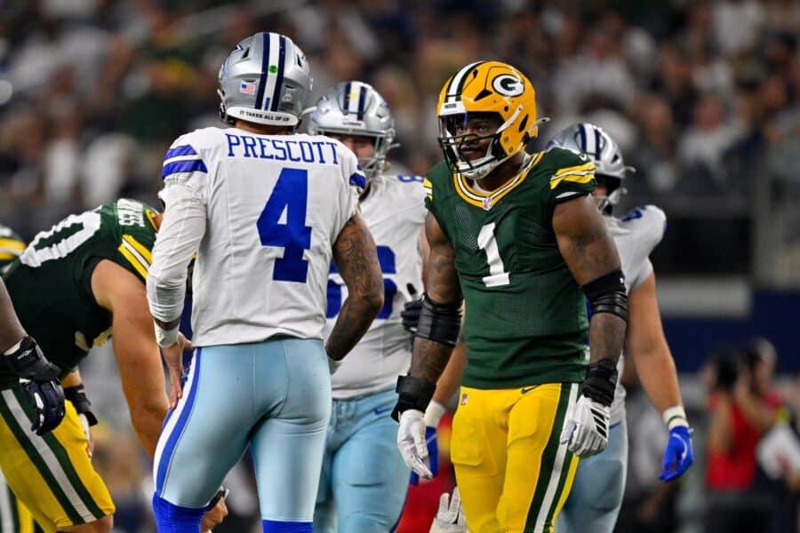 Sep 28, 2025; Arlington, Texas, USA; Green Bay Packers defensive end Micah Parsons (1) stares at Dallas Cowboys quarterback Dak Prescott (4) during the game between the Dallas Cowboys and the Green Bay Packers at AT&T Stadium. Mandatory Credit: Jerome Miron-Imagn Images