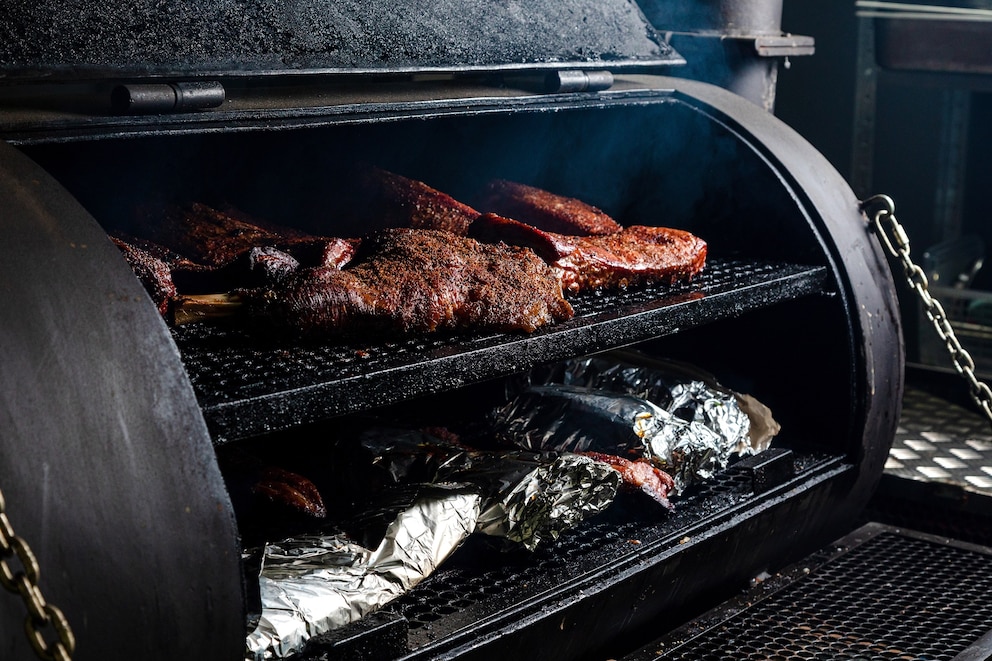 PHOTO: beef is smoked in smoker.